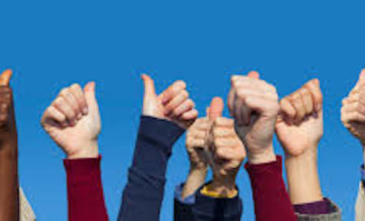 Hands doing thumbs up in the air